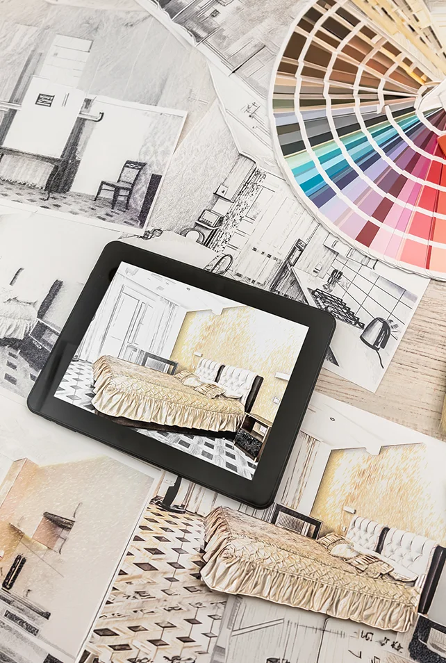 Renovation Services planning a bedroom design with floor plans, color swatches, and a tablet showing the finished room concept 