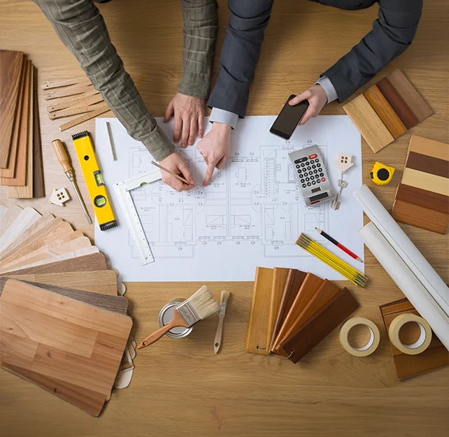 Renovation Services professionals installing new flooring in a modern apartment during a home remodeling project 